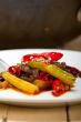 fried chili pepper and vegetable on a wok pan