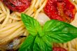 spaghetti pasta with baked cherry tomatoes and basil 