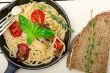 spaghetti pasta with baked cherry tomatoes and basil 