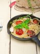 spaghetti pasta with baked cherry tomatoes and basil 