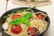 spaghetti pasta with baked cherry tomatoes and basil 
