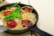 spaghetti pasta with baked cherry tomatoes and basil 