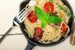 spaghetti pasta with baked cherry tomatoes and basil 
