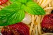 spaghetti pasta with baked cherry tomatoes and basil 