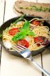 spaghetti pasta with baked cherry tomatoes and basil 