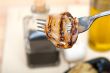 grilled onion on a fork