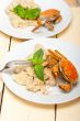 Italian gnocchi with seafood sauce with crab and basil