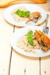 Italian gnocchi with seafood sauce with crab and basil