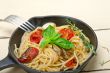 spaghetti pasta with baked cherry tomatoes and basil 