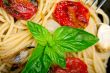 spaghetti pasta with baked cherry tomatoes and basil 