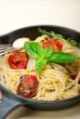 spaghetti pasta with baked cherry tomatoes and basil 