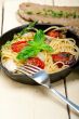 spaghetti pasta with baked cherry tomatoes and basil 