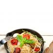 spaghetti pasta with baked cherry tomatoes and basil 