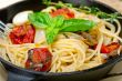 spaghetti pasta with baked cherry tomatoes and basil 