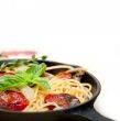 spaghetti pasta with baked cherry tomatoes and basil 