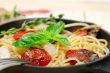 spaghetti pasta with baked cherry tomatoes and basil 