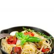 spaghetti pasta with baked cherry tomatoes and basil 