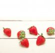 fresh organic strawberry over white wood