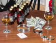 money and glass of whiskey