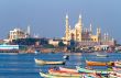 Arabian see, fishing harbour, boats and mosque