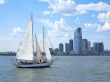 City and a Sail Boat