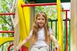 Active girl on nursery platform in summer