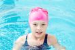 Cute girl in swimming pool