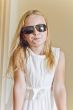 Cute girl playing with sunglasses