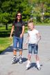 Learning mother and daughter on roller skates