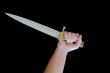 Cold weapon in human hand
