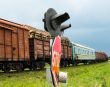 Freight train passing the railroad crossing